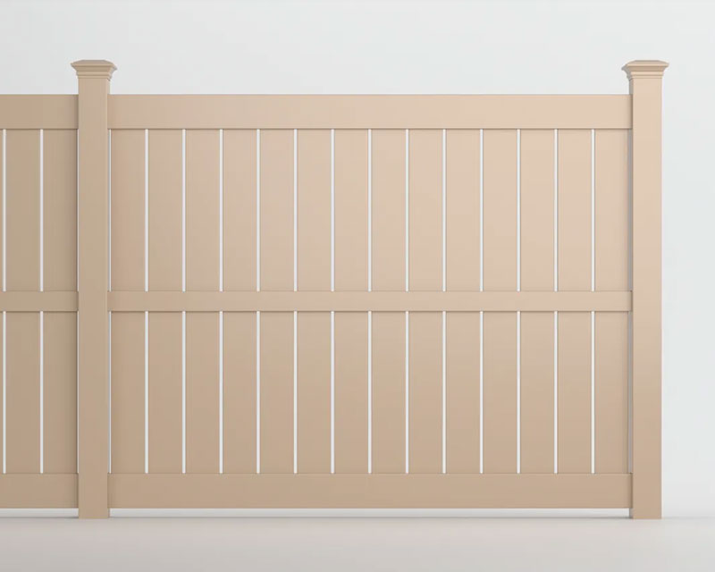 Clay coloured vinyl fence of wide boards separated by thin slits, split by a centre rail
