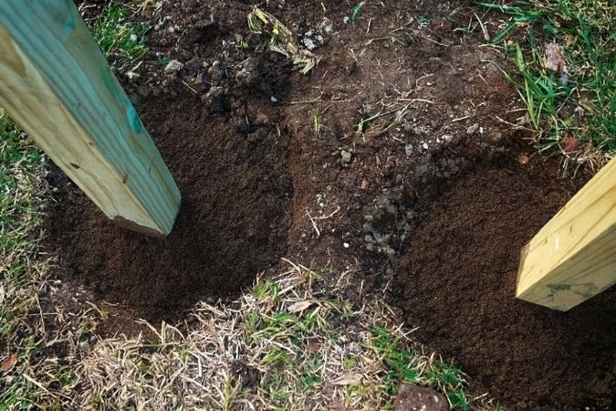 post holes filled with dirt