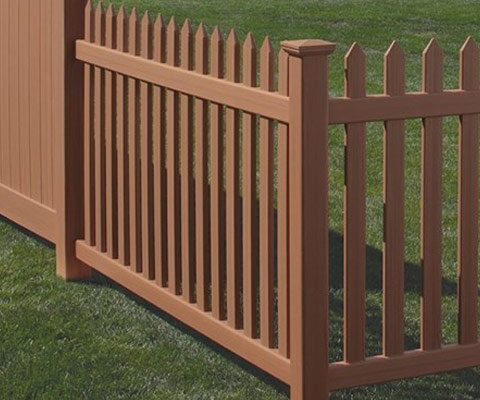 Bufftech Fence A rendered wood-tone vinyl picket fence with pointed pickets and a solid privacy section at the left