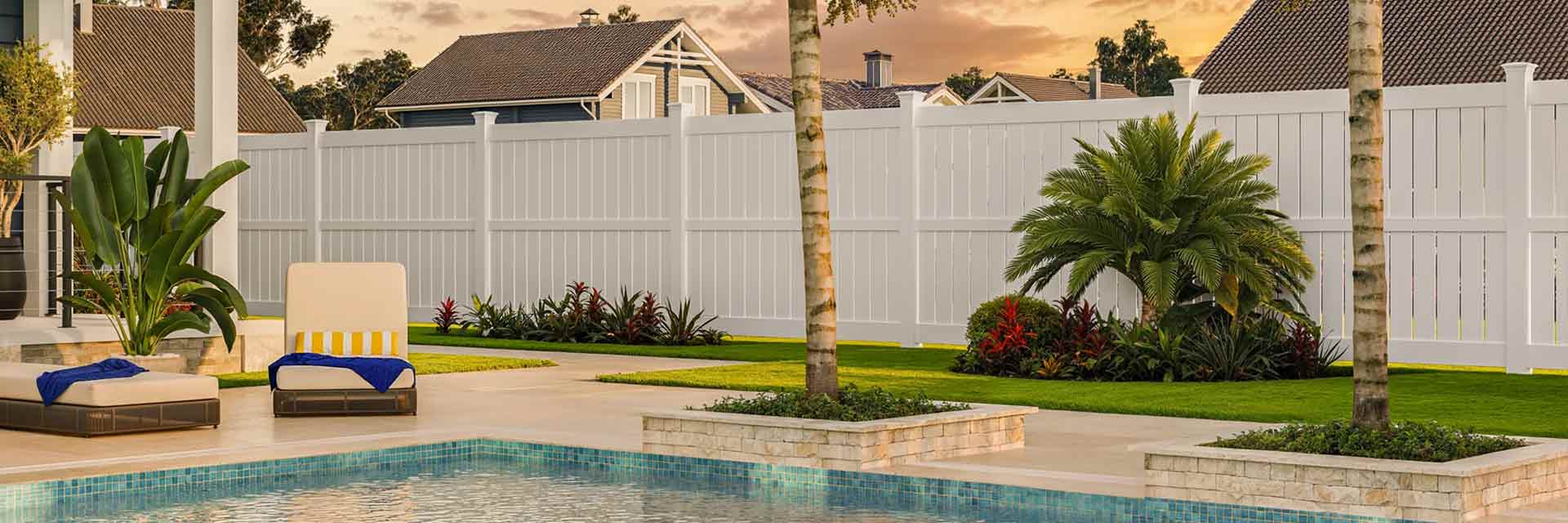 Semi-private vinyl fence enclosing a backyard swimming pool