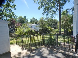 Matte black aluminum pet fence with close picket spacing in Brentwood, MO (view 1 of 3)