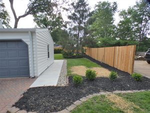 Yard before 4-foot matte black aluminum pet fence installation in Kirkwood, MO (view 1 of 2)
