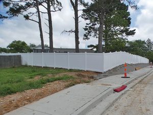 6-foot white vinyl privacy fence securing the pool area in Arnold, MO (view 1 of 2)