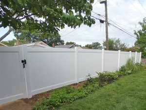 6-foot white vinyl privacy fence after installation in St. Louis, MO (view 1 of 3)